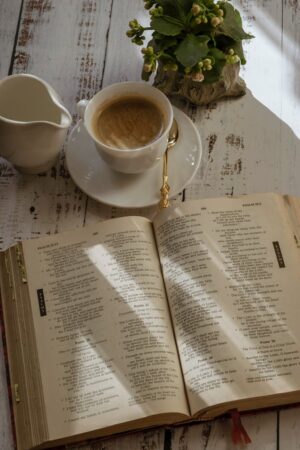 a bible and a cup of coffee